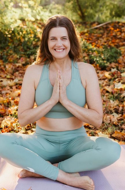 yoga-square Leanne Tomlinson health and wellness coach practicing yoga